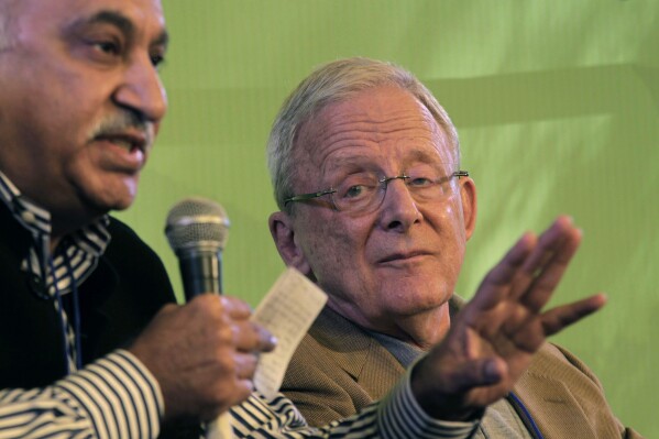 FILE -Indian journalist M.J. Akbar, left, speaks as former New York Times editor and Pulitzer Prize winner Joseph Lelyveld looks on during Jaipur Literature Festival in Jaipur, in the western Indian state of Rajasthan, India, Saturday, Jan. 21, 2012. Joseph Lelyveld, a career news person who rose from copy boy to foreign correspondent to executive editor at The New York Times and won a Pulitzer Prize for a nonfiction book, has died on Friday, Jan. 5, 2024. He was 86. (AP Photo/ Manish Swarup, File)