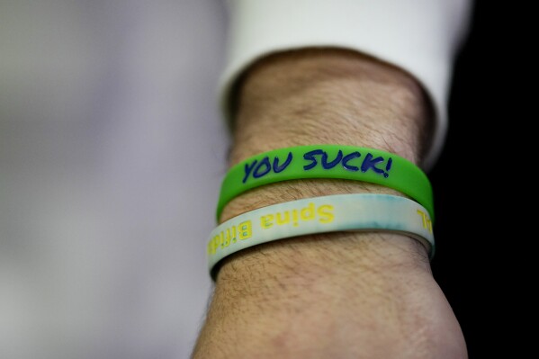 Notre Dame quarterback Riley Leonard shows a wristband that reminds him to stay humble during media day ahead of the College Football Playoff national championship game between Ohio State and Notre Dame Saturday, Jan. 18, 2025, in Atlanta. The game will be played on Monday.(AP Photo/Chris Carlson)