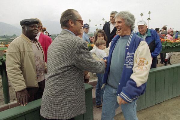 FILE - Actor Jack Nicholson, left, congratulates Academy Award-winner composer Burt Bacharach in the winner's circle after Bacharach's horse Soul of the Matter won the San Felipe Stakes horse race at Santa Anita on March 20, 1994, in Arcadia. Calif. Not all of Bacharach's hits were on the charts. The songwriter and pianist scored at the racetrack, too. Bacharach died Wednesday, Feb. 8, 2023, in Los Angeles of natural causes. He was 94.(AP Photo/Douglas C. Pizac, File)