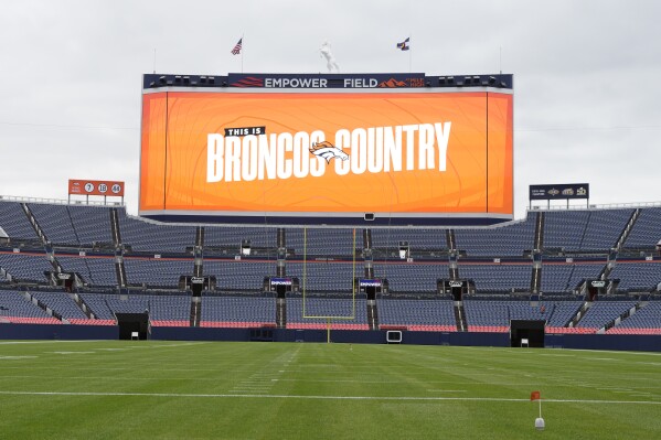 A message flashes across the screen of the new scoreboard over the south stands of Empower Field at Mile High, home to the NFL football team the Denver Broncos, during a media tour to show the $100-million upgrades made Friday, Aug. 25, 2023, in Denver. The upgrades include the new scoreboard, which is the fifth-largest in the league, as well as premium hospitality areas, renovated suites and team store plus artwork scattered throughout the stadium featuring the Broncos' history. (AP Photo/David Zalubowski)