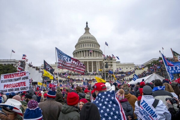 FILE - Rioters loyal to President Donald Trump at the U.S. Capitol in Washington, Jan. 6, 2021. Two Missouri men are facing federal charges accusing them of assaulting police officers during the U.S. Capitol riot, including pushing bike racks that were being used as barricades into a line of officers. (AP Photo/Jose Luis Magana, File)