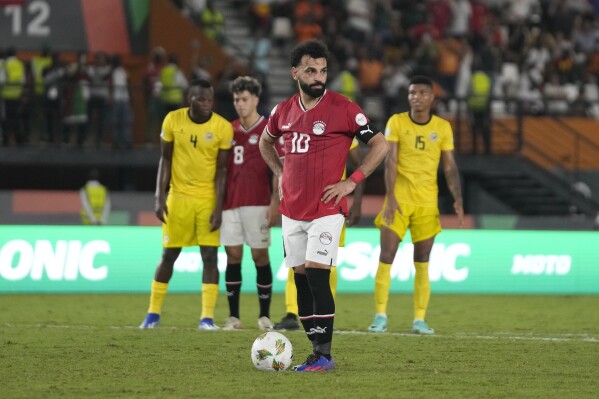 Egypt's Mohamed Salah wait to take a penalty, which he scores for his side second goal of the game during the African Cup of Nations Group B soccer match between Egypt and Mozambique in Abidjan, Ivory Coast, Sunday, Jan. 14, 2024. (AP Photo/Themba Hadebe)