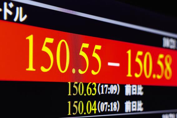 A monitor shows exchange rate of the yen against U.S. dollar in Tokyo on Oct. 21, 2022. The heavy selling of yen for U.S. dollars has left the dollar at its highest level against the yen in three decades, now at about 150 yen.  (Kyodo News via AP)