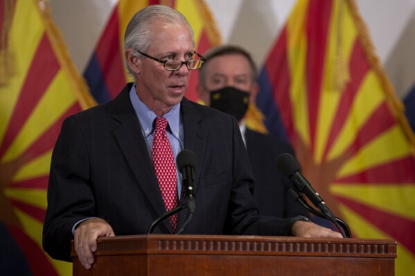 FILE - University of Arizona President Robert C. Robbins speaks during a press conference regarding innovative COVID-19 solutions on Thursday, Sept. 24, 2020, at the Phoenix Biomedical Campus. Students and faculty members harshly criticized Robbins on Thursday, Nov. 16, 2023, over a $240 million budget shortfall that has sparked proposals for cuts in student financial assistance and instructor hiring freezes and salary cuts. (Sean Logan/The Arizona Republic via AP)