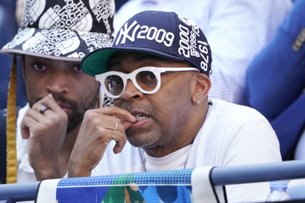 Director Spike Lee, right, watches Coco Gauff, of the United States, face Caroline Wozniacki, of Denmark, during the fourth round of the U.S. Open tennis championships, Sunday, Sept. 3, 2023, in New York. (AP Photo/Eduardo Munoz Alvarez)