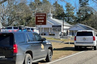 The Smith County Sheriff's Office investigates a fatal shooting incident at the Starville Methodist Church in Winona, Texas, on Sunday morning, Jan. 3, 2021. A suspect who fled has been arrested, said the sheriff’s office. (Zak Wellerman/Tyler Morning Telegraph via AP)