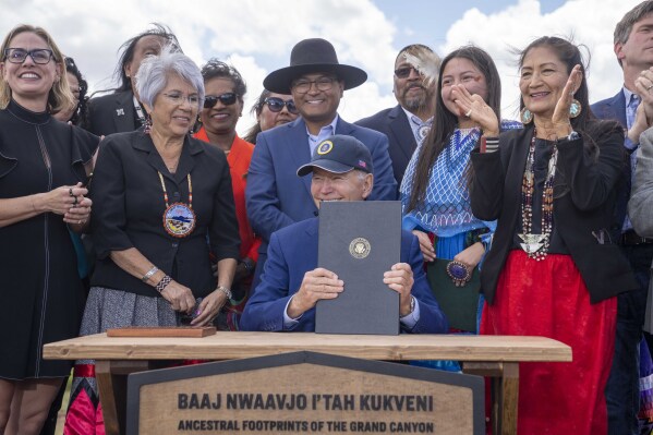 FILE - President Joe Biden smiles after signing a proclamation designating the Baaj Nwaavjo I'Tah Kukveni National Monument at the Red Butte Airfield, Aug. 8, 2023, in Tusayan, Ariz. On Monday, Feb. 12, 2024, the Arizona Legislature's top two Republicans filed a lawsuit alleging that Biden's creation of the monument near Grand Canyon National Park exceeded his legal authority. (AP Photo/Alex Brandon, File)