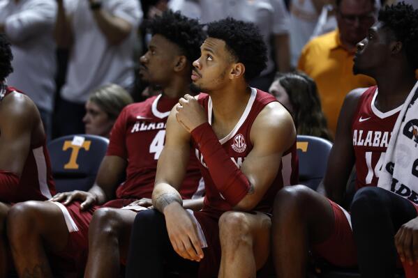 Alabama guard Dominick Welch (10), forward Noah Gurley (4), and center Charles Bediako (14) watch play in the final seconds of the second half of an NCAA college basketball game against Tennessee, Wednesday, Feb. 15, 2023, in Knoxville, Tenn. (AP Photo/Wade Payne)