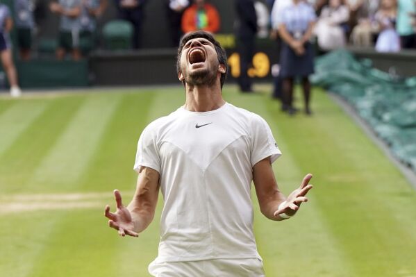 Spain's Carlos Alcaraz celebrates after beating Serbia’s Novak Djokovic to win the final of the men’s singles on day fourteen of the Wimbledon tennis championships in London, Sunday, July 16, 2023. (Victoria Jones/PA via AP)
