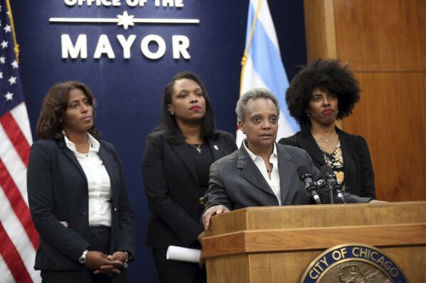 Mayor Lori Lightfoot, joined by Chicago Public Schools CEO Janice Jackson, rear center, makes a statement about the Chicago Teachers Union strike Tuesday, Oct. 29, 2019, at City Hall in Chicago. (Brian Cassella/Chicago Tribune via AP)