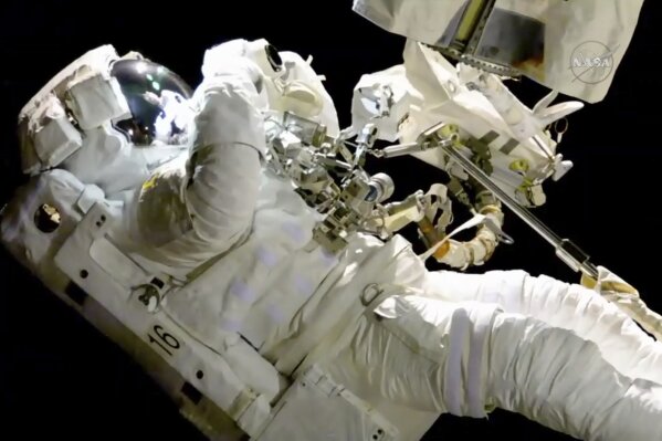
              In this image from video made available by NASA, astronaut Joe Acaba performs a spacewalk outside the International Space Station on Friday, Oct. 20, 2017. Acaba was barely outside an hour when he had to replace one of his safety tethers. Spacewalking astronauts always have more than one of these crucial lifelines in case one breaks. They also wear a jetpack in case all tethers fail and they need to fly back to the space station. (NASA via AP)
            
