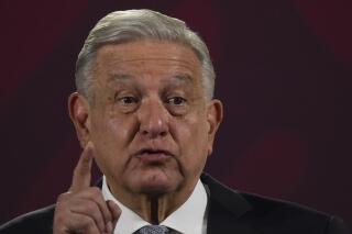 FILE - Mexican President Andres Manuel Lopez Obrador gives his regularly scheduled morning press conference at the National Palace in Mexico City, Feb. 28, 2023. Mexico’s president claimed Monday, March 13, 2023 that his country is safer than the United States. (AP Photo/Marco Ugarte, File)