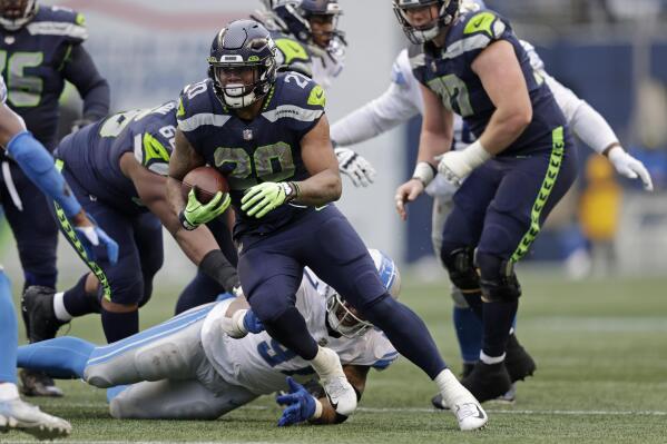 Penny, Metcalf lead Seahawks to 51-29 blowout of Lions