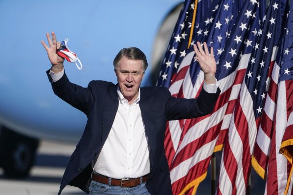 Sen. David Perdue, R-Ga., arrives to speak before Vice President Mike Pence during a "Save the Majority" rally on Thursday, Dec. 10, 2020, in Augusta, Ga. (AP Photo/John Bazemore)