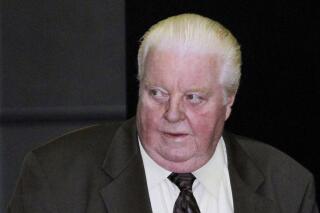 FILE - In this June 8, 2010 file photo former Chicago Police commander Jon Burge, is seen at the Federal Courthouse in Chicago. The city of Chicago pursues a "two-faced" strategy of acknowledging an ugly history of police brutality in public while directing its lawyers to deny that legacy in court when victims sue, a cross-section of community leaders alleged in a court filing Thursday, May 19, 2022. The filing is in a lawsuit by 55-year-old James Gibson, freed after 29 years when courts agreed officers under commander Burge tortured him into implicating himself in the 1989 slayings of two men.(AP Photo/Charles Rex Arbogast, File)