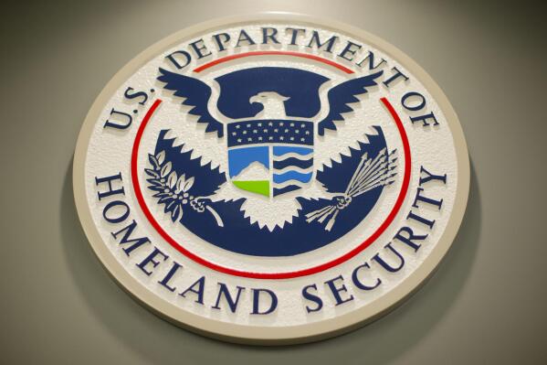FILE - Homeland Security logo is seen during a joint news conference in Washington, Feb. 25, 2015. The Department of Homeland Security paused the work of its new disinformation governance board Wednesday. The move responds to weeks of criticism from Republicans and questions about whether the board would impinge on Americans’ free speech rights. A statement says DHS’ advisory board on homeland security will review the board’s work.  (AP Photo/Pablo Martinez Monsivais, File)