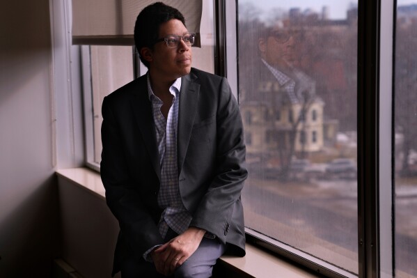Ellis Monk, professor of Sociology at Harvard University and developer of the Monk Skin Tone Scale, poses at his office, Wednesday, Feb. 26, 2025, in Cambridge, Mass. (AP Photo/Charles Krupa)