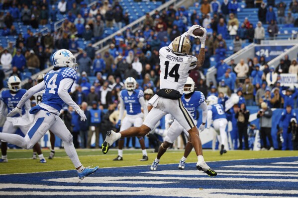 FILE - Vanderbilt wide receiver Will Sheppard (14) scores the game winning touchdown against Kentucky during an NCAA college football game in Lexington, Ky., Saturday, Nov. 12, 2022. Vanderbilt opens their season at home against Hawaii on Aug. 26. (AP Photo/Michael Clubb, File)