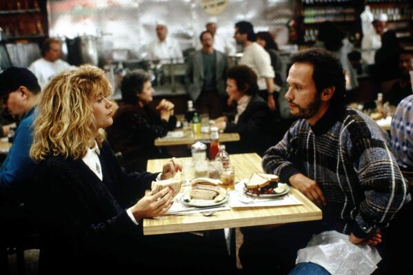 This image released by the Library of Congress shows Meg Ryan, left, and Billy Crystal in a scene from "When Harry Met Sally." (MGM/Library of Congress via AP)