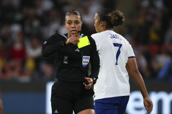 Referee Melissa Borjas shows a yellow card to England's Lauren James during the Women's World Cup round of 16 soccer match between England and Nigeria in Brisbane, Australia, Monday, Aug. 7, 2023. (AP Photo/Tertius Pickard)