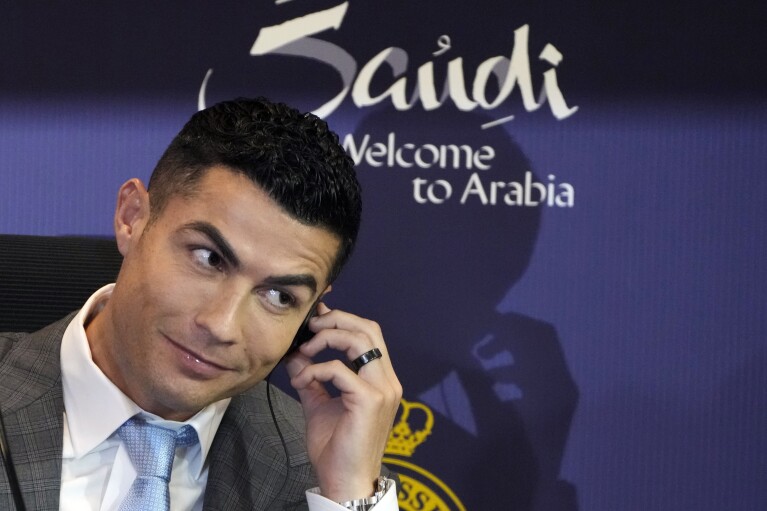 FILE - Soccer star Cristiano Ronaldo speaks during a press conference for his official unveiling as a new member of Al Nassr soccer club in in Riyadh, Saudi Arabia, Tuesday, Jan. 3, 2023. One of soccer’s biggest stars, Ronaldo, joined the Saudi team backed by the same investment fund that supported LIV in a deal worth a reported $200 million a year. (AP Photo/Amr Nabil, File)