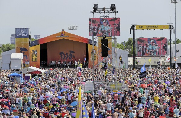 FILE - Jimmy Buffett performs on the Acura Stage during the New Orleans Jazz & Heritage Festival on Sunday, May 5, 2019. (David Grunfeld /The Times-Picayune/The New Orleans Advocate via AP)