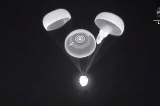 This image provided by NASA shows three of the four parachutes deploying on a cargo ship returning on Jan. 24, 2022. SpaceX and NASA are investigating a parachute issue that occurred on the last two capsule flights.  One of the four main parachutes was slow to inflate during the return of four astronauts to Earth last November. The same thing happened last week as another Dragon capsule was bringing back science experiments. In both cases, the sluggish parachute eventually opened and inflated _ although more than a minute late _ and the capsules splashed down safely. (NASA via AP)