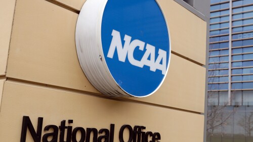 FILE - Signage at the headquarters of the NCAA is viewed in Indianapolis, March 12, 2020. The NCAA has changed its reinstatement process for athletes involved in sports wagering. (AP Photo/Michael Conroy, File)