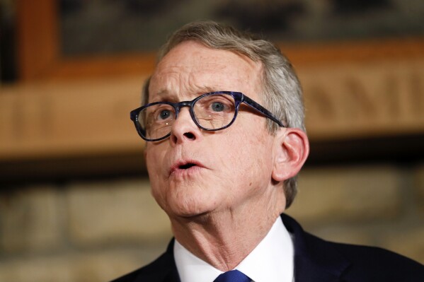 FILE - Mike DeWine speaks, Jan. 14, 2019, in Cedarville, Ohio. Ohio's Health Department has backed off proposed rules that would have restricted gender-affirming care for adults. The new proposal Wednesday, Feb. 7, 2024 comes after gathering public comment on a proposal released last month. Transgender people and their healthcare providers feared the original rules would have left thousands of patients scrambling to find care — and facing health risks in the meantime. The proposed rules are also relaxed for requirements for treatment for minors, some of which was banned by a law adopted last month when the Legislature overrode Gov. Mike DeWine's earlier veto. (AP Photo/John Minchillo, Pool)