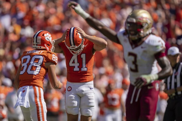 Clemson place kicker Jonathan Weitz (41) reacts after missing a field goal late in the fourth quarter during an NCAA college football game against Florida State, Saturday, Sept. 23, 2023, in Clemson, S.C. (AP Photo/Jacob Kupferman)