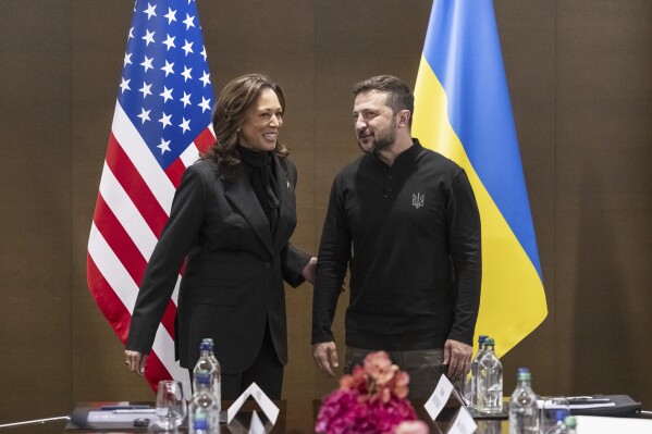 US Vice President Kamala Harris, left, is welcomed by Ukraine's President Volodymyr Zelenskyy during the Summit on peace in Ukraine, in Obbürgen near Lucerne, Switzerland, Saturday, June 15, 2024. (Alessandro della Valle/Keystone via AP)
