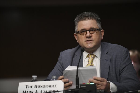 FILE - In this June 9, 2020, file photo, Federal Housing Finance Agency Director Mark Calabria testifies before a Senate Banking, Housing, and Urban Affairs Committee hearing on Capitol Hill in Washington. The Supreme Court is hearing a case on Dec. 9, 2020, that could make it easier for the president to fire the head of the agency that oversees government-controlled mortgage giants Fannie Mae and Freddie Mac. The case could also mean undoing an arrangement between the companies and the government that has sent $246 billion in their profits to the Treasury. That was compensation for the taxpayer bailout they received after the 2007 housing market crash. (Astrid Riecken/The Washington Post via AP, Pool)