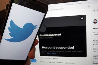 This Thursday, May 11, 2023, image taken in New York, shows the account suspended notice of Jessica Reed on the Twitter page of her younger sister Emily Reed. On Monday, May 8, 2023, Twitter CEO Elon Musk announced the platform would be "purging accounts that have had no activity at all for several years." The news caused outrage among people fearing they could lose tweets that now-inactive accounts, including those belonging to users who have died, left behind on the app. (AP Photo/Richard Drew)