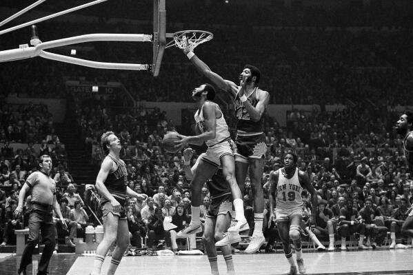 FILE - New York Knicks' Walt Frazier (10) goes up for a shot in the fourth period of the game at New York's Madison Square Garden, March 14, 1973. (AP Photo/John Lent, File)