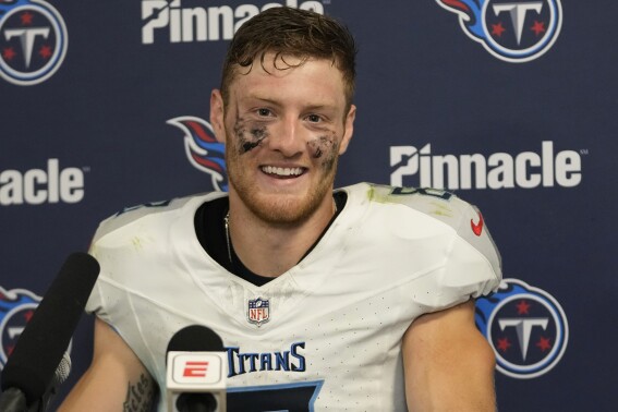 FILE - Tennessee Titans quarterback Will Levis smiles during a news conference following an NFL football game against the Miami Dolphins, Tuesday, Dec. 12, 2023, in Miami. Levis couldn't be happier at seeing all the new teammates Tennessee has added this offseason both through free agency and the draft. (AP Photo/Lynne Sladky, File)