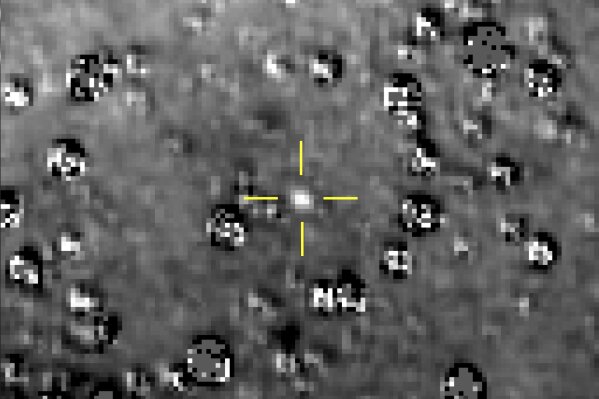 
              FILE - This composite image made available by NASA shows the Kuiper Belt object nicknamed "Ultima Thule," indicated by the crosshairs at center, with stars surrounding it on Aug. 16, 2018, made by the New Horizons spacecraft. The brightness of the stars was subtracted from the final image using a separate photo from September 2017, before the object itself could be detected. (NASA/Johns Hopkins University Applied Physics Laboratory/Southwest Research Institute via AP)
            