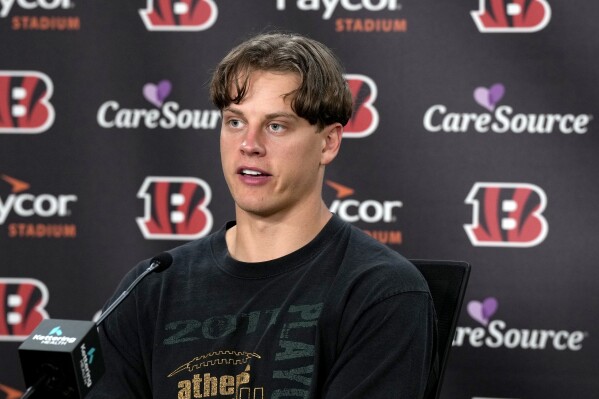 Cincinnati Bengals quarterback Joe Burrow speaks during an NFL football news conference, Saturday, Sept. 9, 2023, at Paycor Stadium in Cincinnati. Burrow became the highest-paid player in the NFL when he agreed to a five-year, $275 million contract extension with the Bengals. (Cara Owsley/The Cincinnati Enquirer via AP)