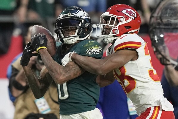 FILE - Philadelphia Eagles wide receiver DeVonta Smith, left, cannot catch a pass while being defended by Kansas City Chiefs cornerback L'Jarius Sneed during the first half of the NFL Super Bowl 57 football game between the Kansas City Chiefs and the Philadelphia Eagles, Sunday, Feb. 12, 2023, in Glendale, Ariz. Few college programs have had as much success or produced as many star players in the NFL as Alabama. Amazingly, there is still something no player who ended his college career playing for the Crimson Tide has done: score a point in a Super Bowl. (AP Photo/Brynn Anderson, File)