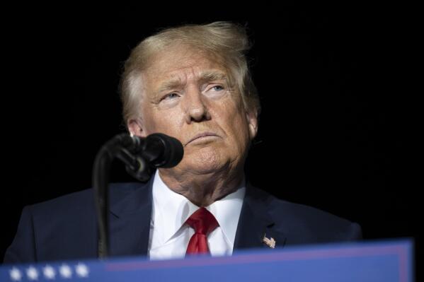 FILE - Former President Donald Trump pauses while speaking at a rally at the Minden Tahoe Airport in Minden, Nev., on Oct. 8, 2022.  (AP Photo/José Luis Villegas, Pool, File)