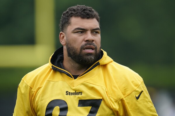 FILE - Pittsburgh Steelers defensive lineman Cam Heyward prepares to go through drills during NFL football practice, Tuesday, June 7, 2022, in Pittsburgh. Heyward made his first appearance at organized team activities on Tuesday, June 4, 2024. The longtime defensive captain is hoping to sign a new contract with the team as he enters the final year of his current deal. (AP Photo/Keith Srakocic, File