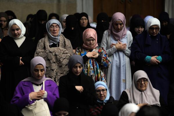 Muslims attend Eid al-Fitr prayers marking the end of the Muslim holy fasting month of Ramadan at Fatih mosque in Istanbul, Turkey, Friday, April 21, 2023. (AP Photo/Khalil Hamra)