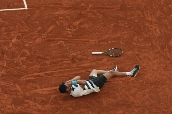 Spain's Carlos Alcaraz celebrates after winning the final match of the French Tennis Open against Italy's Jannik Sinner at the Roland-Garros stadium in Paris, Sunday, June 8, 2025. (AP Photo/Lindsey Wasson)
