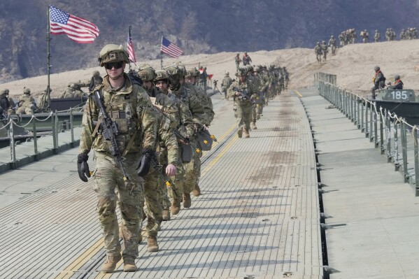 U.S. Army soldiers cross a floating bridge on the Imjin River during a joint river-crossing exercise between South Korea and the United States as a part of the Freedom Shield military exercise in Yeoncheon, South Korea, March 20, 2025. (AP Photo/Ahn Young-joon, File)