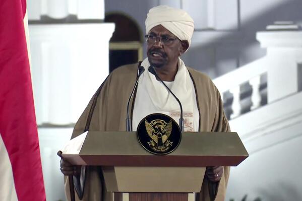 FILE - In this image taken from video, Sudan's President Omar al-Bashir speaks at the Presidential Palace, Friday, Feb. 22, 2019, in Khartoum, Sudan. An attack on the prison holding Omar al-Bashir has raised questions about his whereabouts as the country's two top generals battle for power. The military says he is being held in a secure location, while the paramilitary Rapid Support Forces allege that he has been released. Al-Bashir, who ruled Sudan for three decades despite wars and sanctions, was overthrown during a popular uprising in 2019. (AP Photo/Mohamed Abuamrain, File)
