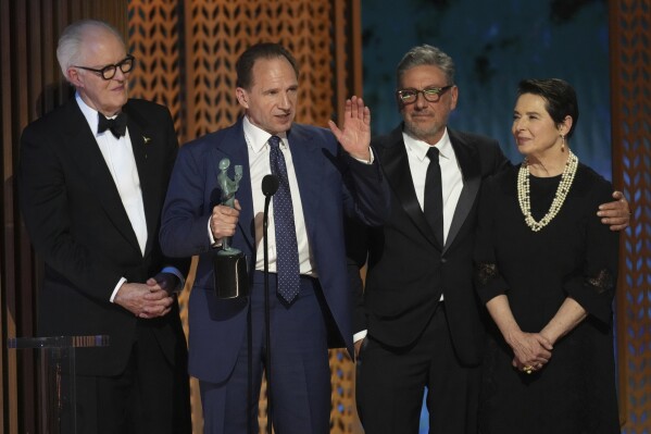 John Lithgow, from left, Ralph Fiennes, Sergio Castellitto, and Isabella Rossellini accepts the award for outstanding performance by a cast in a motion picture for "Conclave" during the 31st annual Screen Actors Guild Awards on Sunday, Feb. 23, 2025, at the Shrine Auditorium in Los Angeles. (AP Photo/Chris Pizzello)