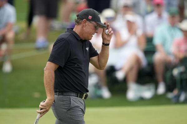 Phil Mickelson tips his cap on the 18th hole during the first round of the Masters golf tournament at Augusta National Golf Club on Thursday, April 6, 2023, in Augusta, Ga. (AP Photo/Charlie Riedel)