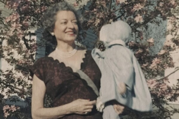 This undated photo provided by Nevada State Police shows Florence Charleston, left, holding one of her nieces, Donna Taylor. In 1978, a garment bag containing a woman's heavily decayed remains was discovered in a remote area of northern Nevada. On Wednesday, June 14, 2023, Nevada State Police announced that advancements in DNA testing led recently to an identification: Florence Charleston, a Cleveland woman who had moved to Portland, Ore., shortly before her death. (Nevada State Police via AP)