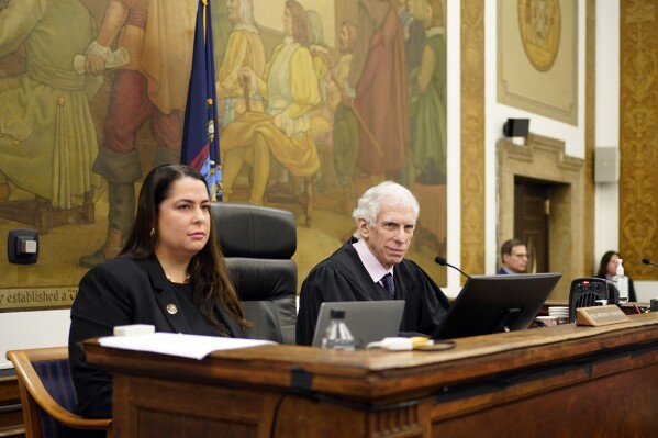 Judge Arthur Engoron, right, and principal law clerk Allison Greenfield sit on the bench during former President Donald Trump's civil business fraud trial at New York Supreme Court, Tuesday, Oct. 17, 2023, in New York. (AP Photo/Seth Wenig, Pool)