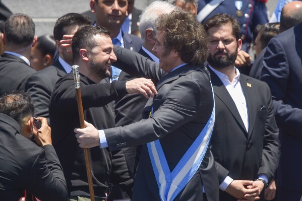 Ukrainia's President Volodymyr Zelenskyy embraces Argentina's newly sworn-in President Javier Milei during at Congress in Buenos Aires, Argentina, Sunday, Dec. 10, 2023. (AP Photo/Gustavo Garello)