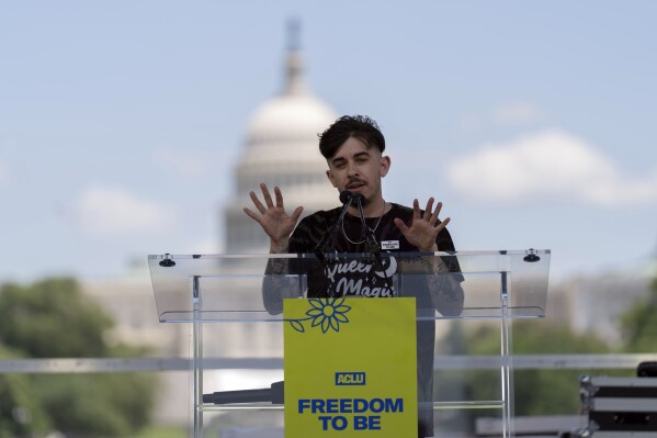 Chase Strangio, co-director of the ACLU's LGBT & HIV Project, speaks during the transgender rights rally on the National Mall, Saturday, May 17, 2025, in Washington. (AP Photo/Jose Luis Magana)